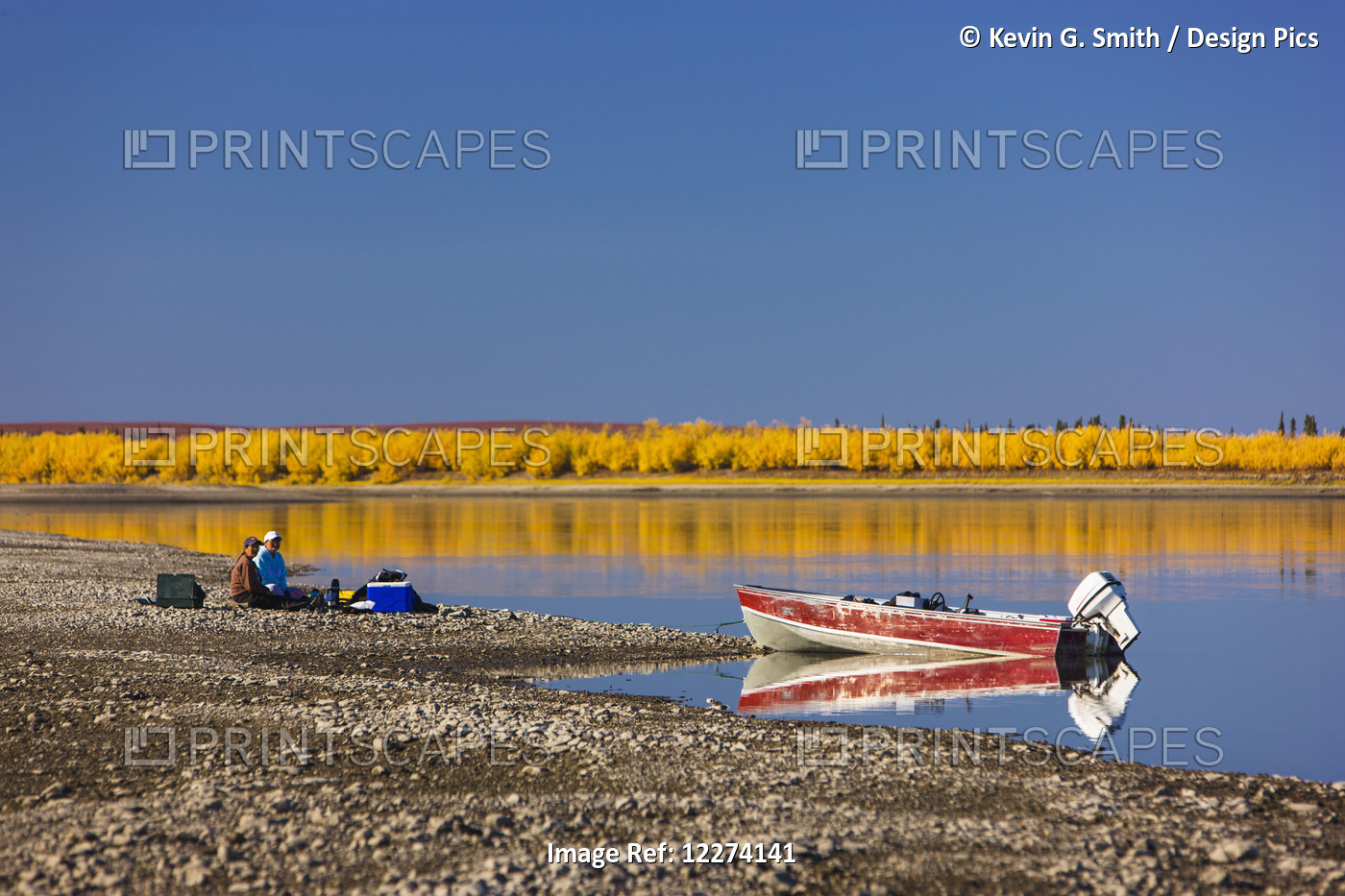 Alaska Native Couple Sit On The Bank Of The Noatak River With A Cooler And ...