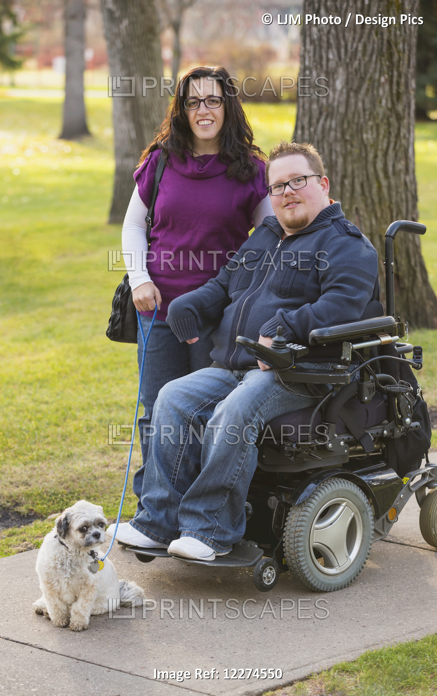 Disabled Husband With His Wife And Their Pet Dog Posing For A Family Portrait ...