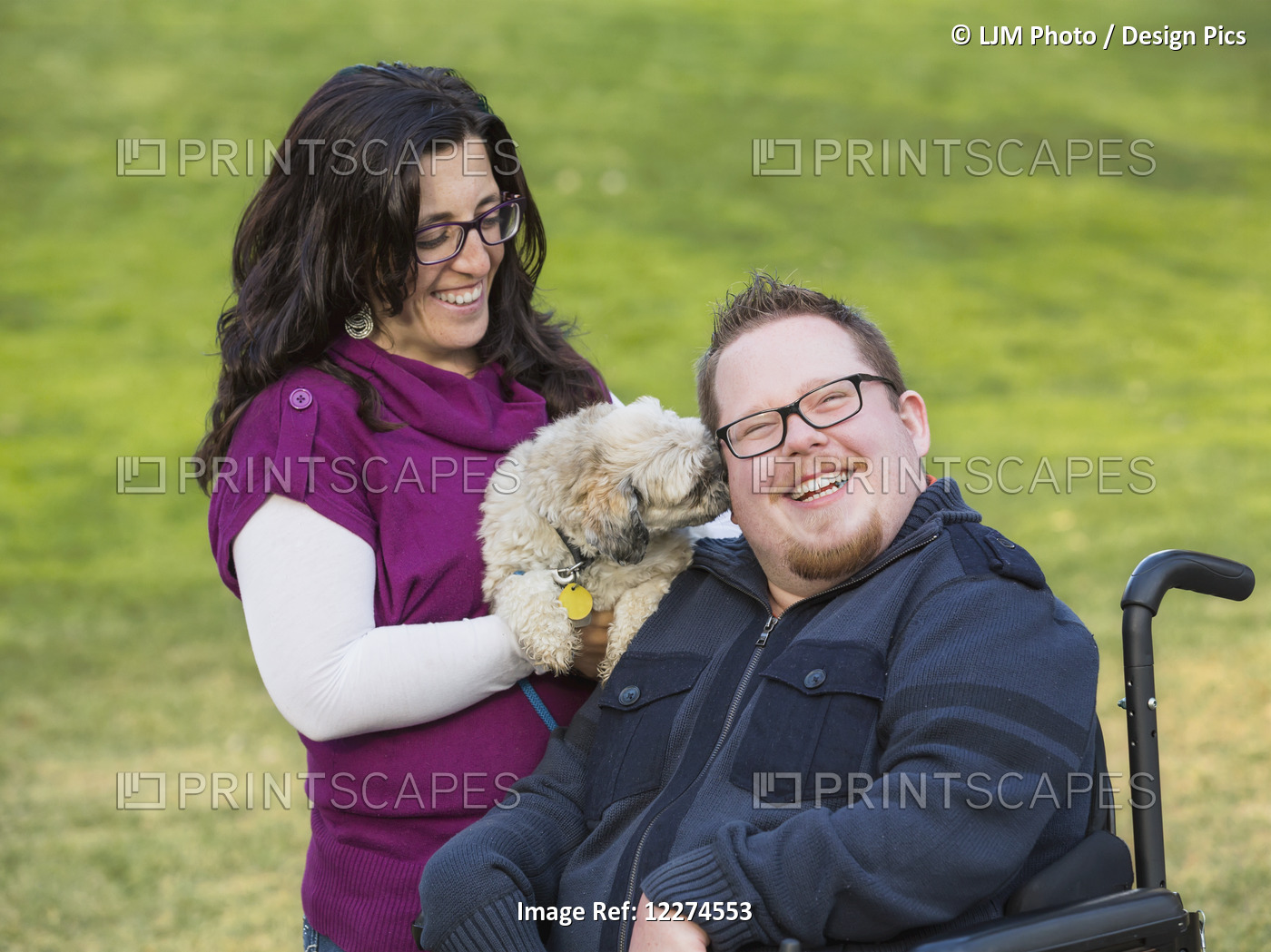 Disabled Husband With His Wife And Their Pet Dog In A Park In Autumn; Edmonton, ...