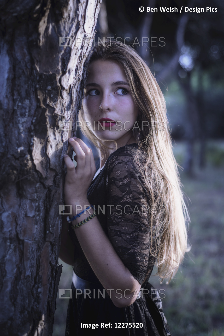 Young Woman Hiding In A Forest; Tarifa, Cadiz, Andalusia, Spain