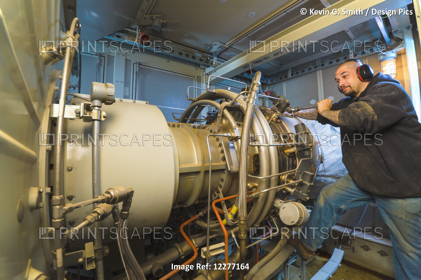 Worker Working On An Electrical Power Plant, Gas Turbine Generator And Drive ...