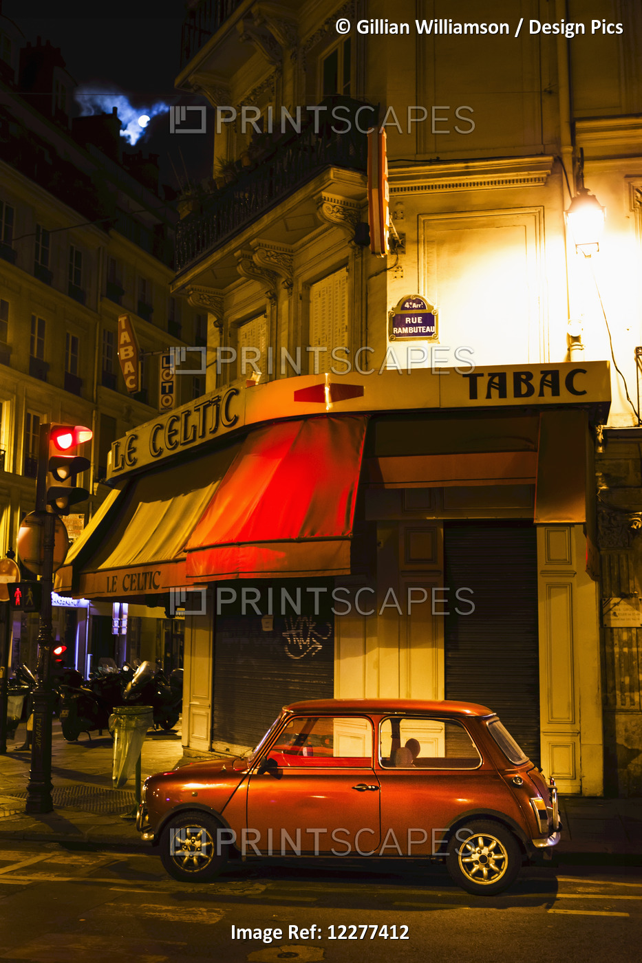 City Street With A Red Hatch Back Car And Full Moon; Paris, France