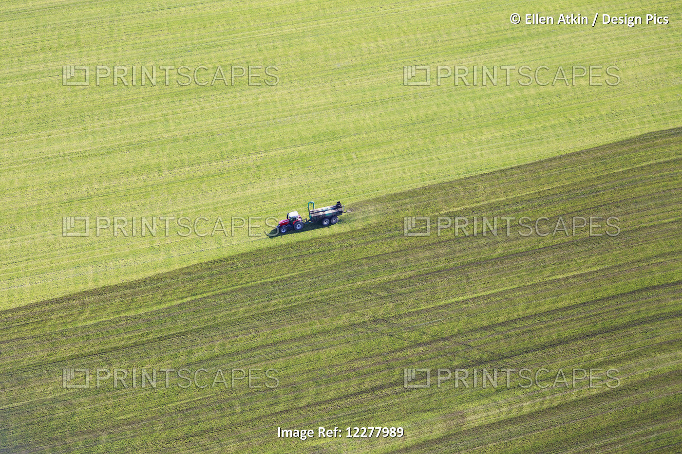 Aerial View Of A Tractor Spreading Manure; Chilliwack, British Columbia, Canada