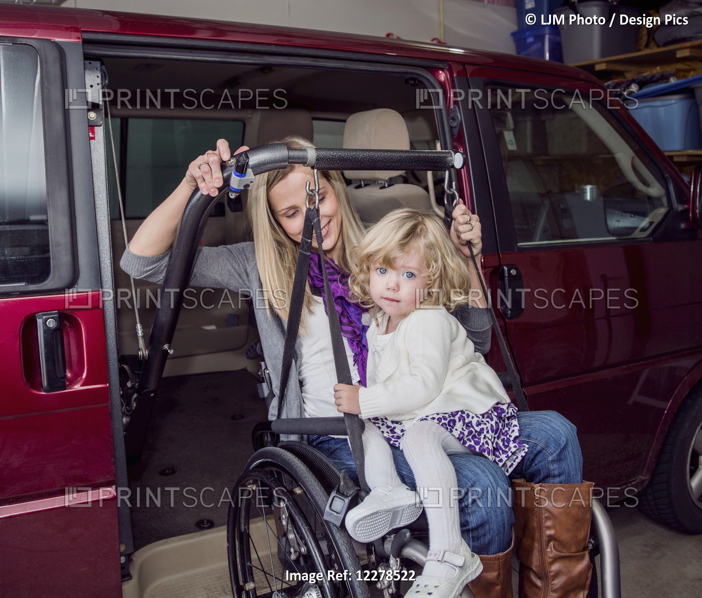 Young Disabled Mother With Her Daughter Using Wheelchair Powered Device To ...