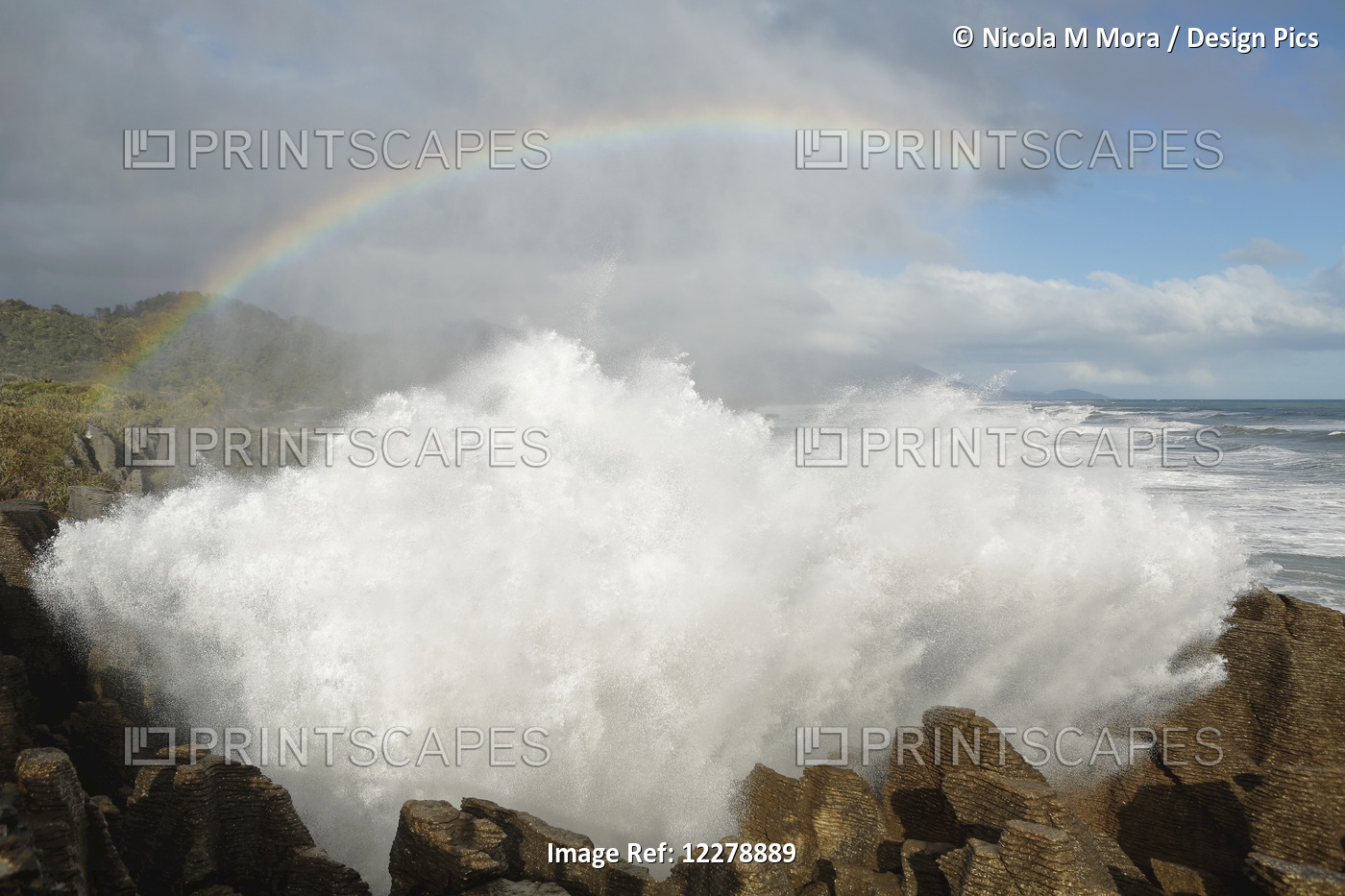 Punakaiki Blowholes With A Rainbow, West Coast Of The South Island; New Zealand