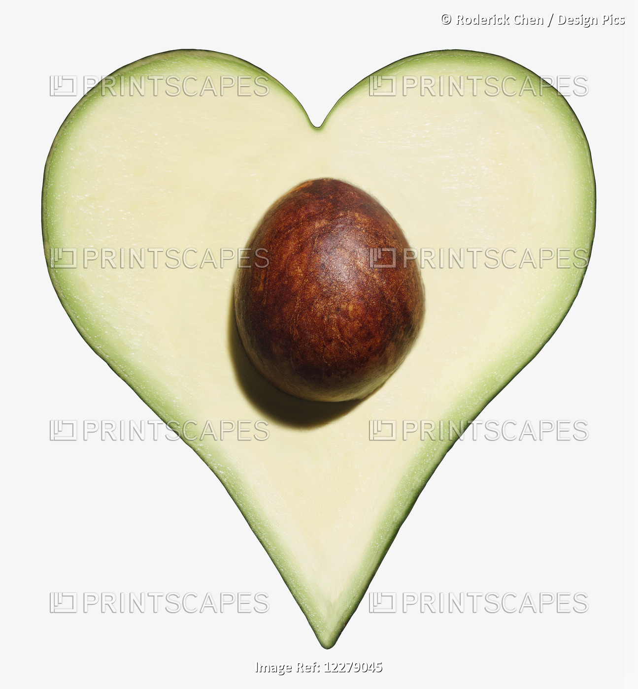 Avocado Cut Into The Shape Of A Heart On A White Background; Montreal, Quebec, ...