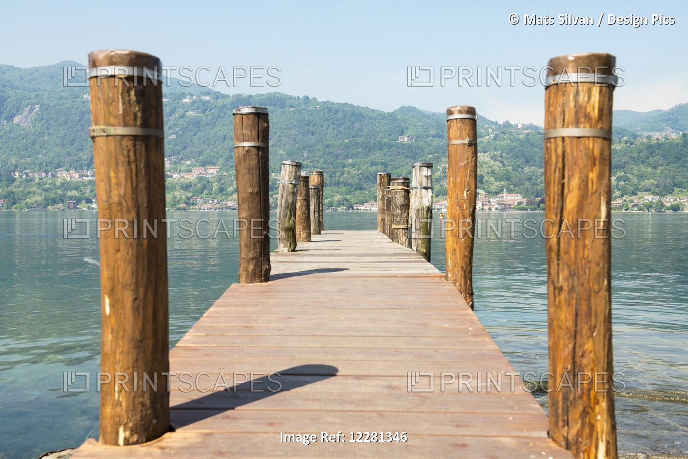 Wooden Dock And Posts On Lake Orta; Orta, Piedmont, Italy