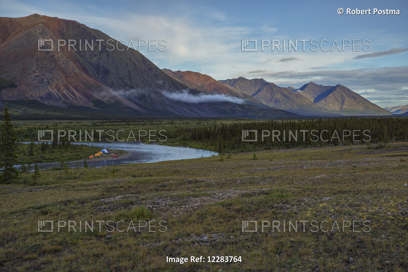 A Campsite Occupied By Canoes And Tents Along The Wind River In The Peel ...