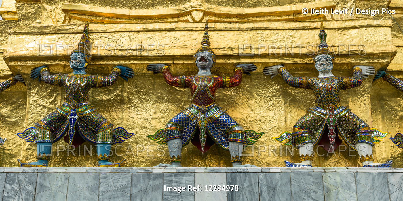Three Statues Along A Gold Wall, Temple Of The Emerald Buddha (Wat Phra Kaew); ...