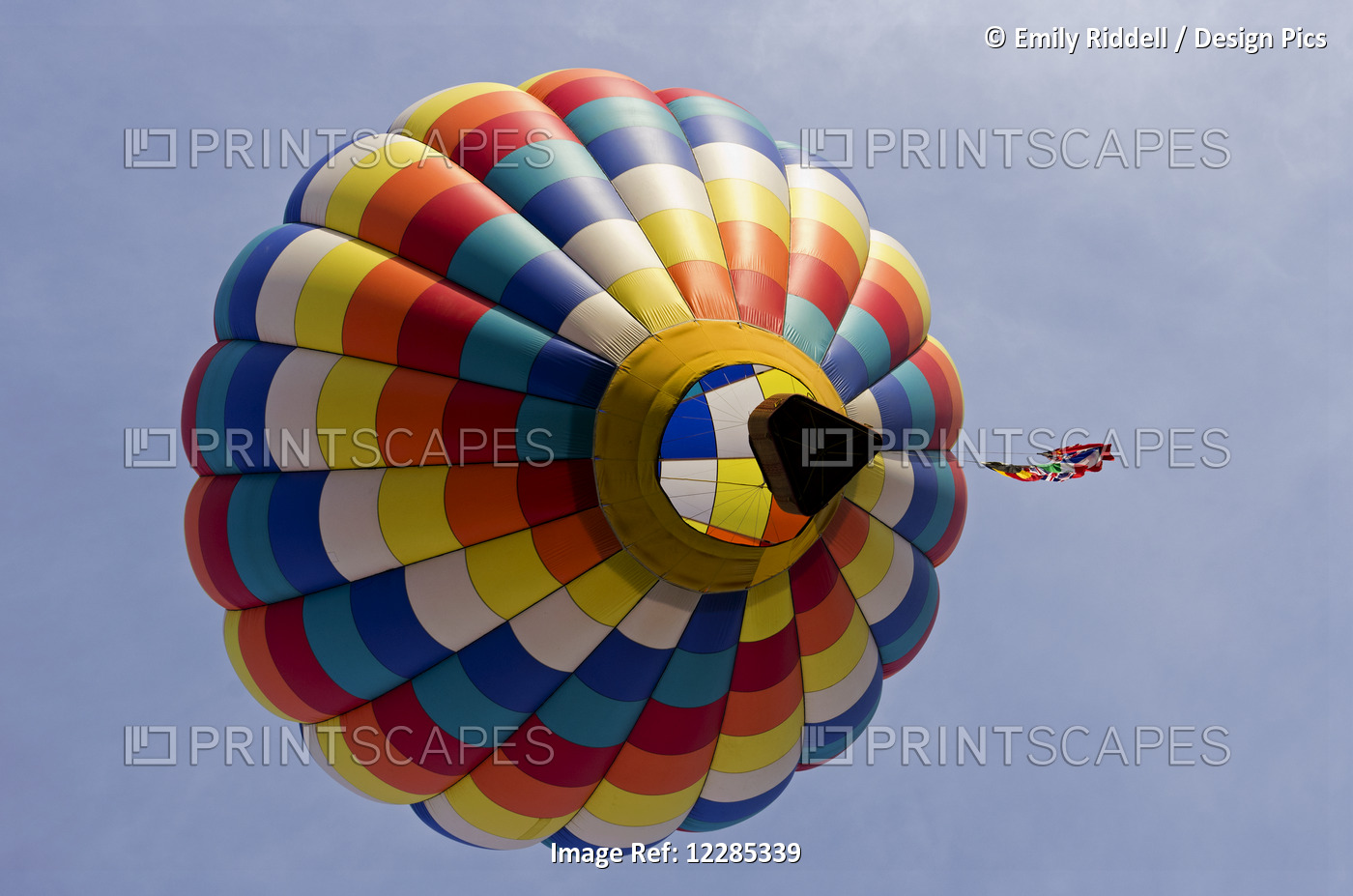 Looking Up Underneath A Colourful Hot Air Balloon Which Floats Away Trailing A ...