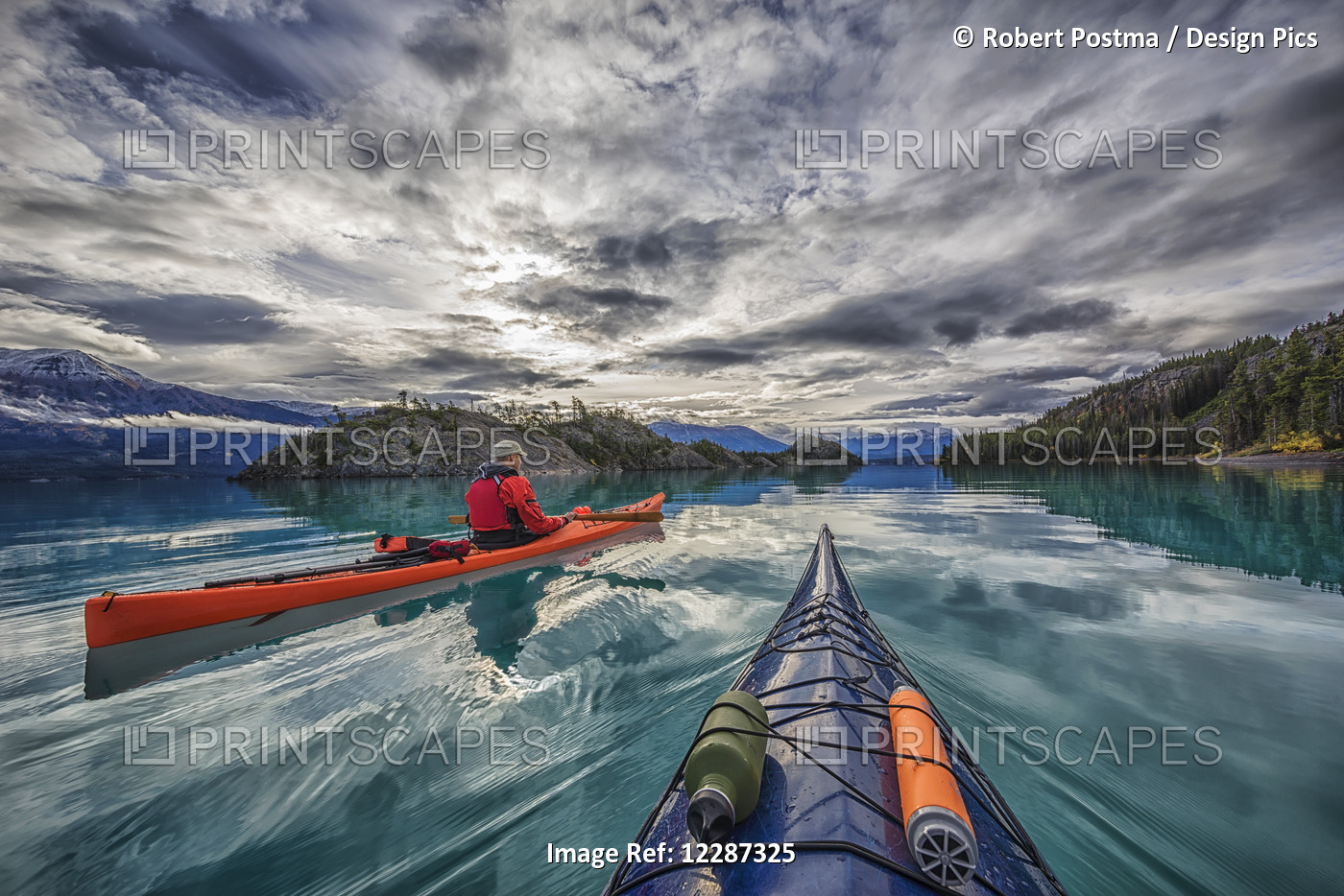 Kayaking On Atlin Lake; Atlin, British Columbia, Canada