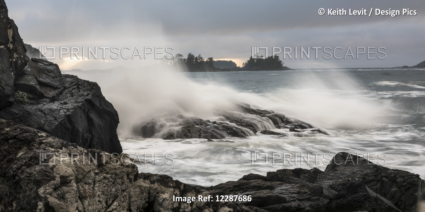 Mist In The Air As Waves Crash Against The Rocky Shore; Tofino, British ...
