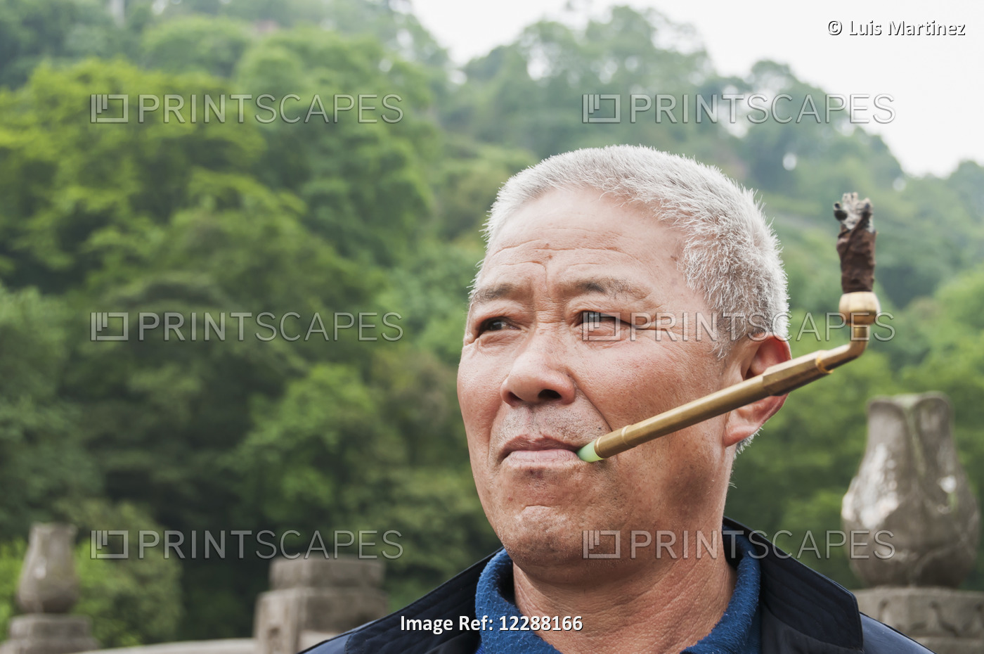 A Man Smoking In Leshan Giant Buddha Scenic Area; Sichuan Province, China