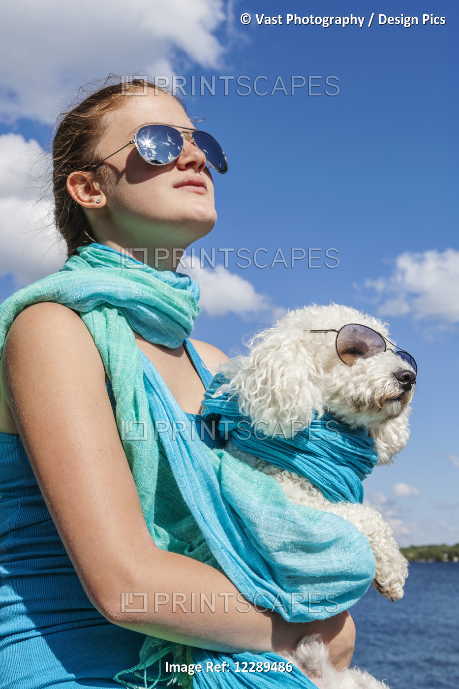 Girl And Her Dog Wearing Matching Sunglasses; Balsam Lake, Ontario, Canada