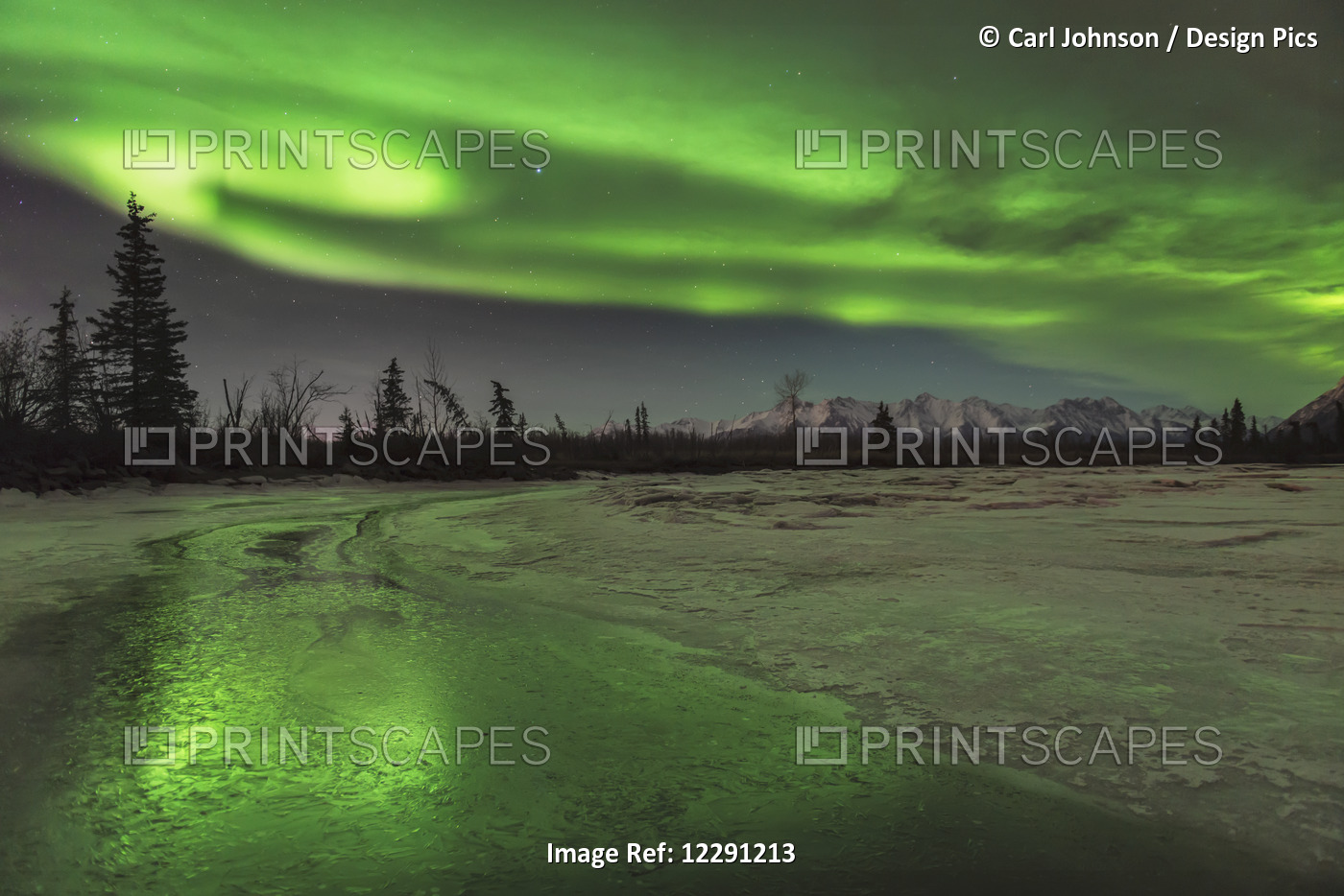Scenic View Of The Aurora Borealis Over The Frozen Knik River, Southcentral ...