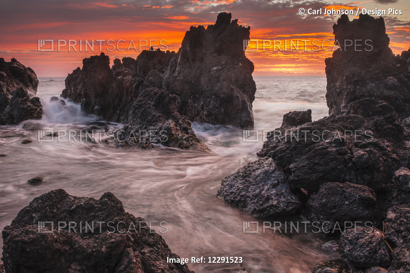 The Colours Of Sunrise Behind Coastal Lava Rocks; Laupahoehoe, Island Of ...