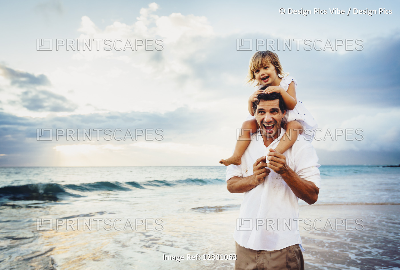 Healthy Loving Father And Daughter Playing Together At The Beach At Sunset ...