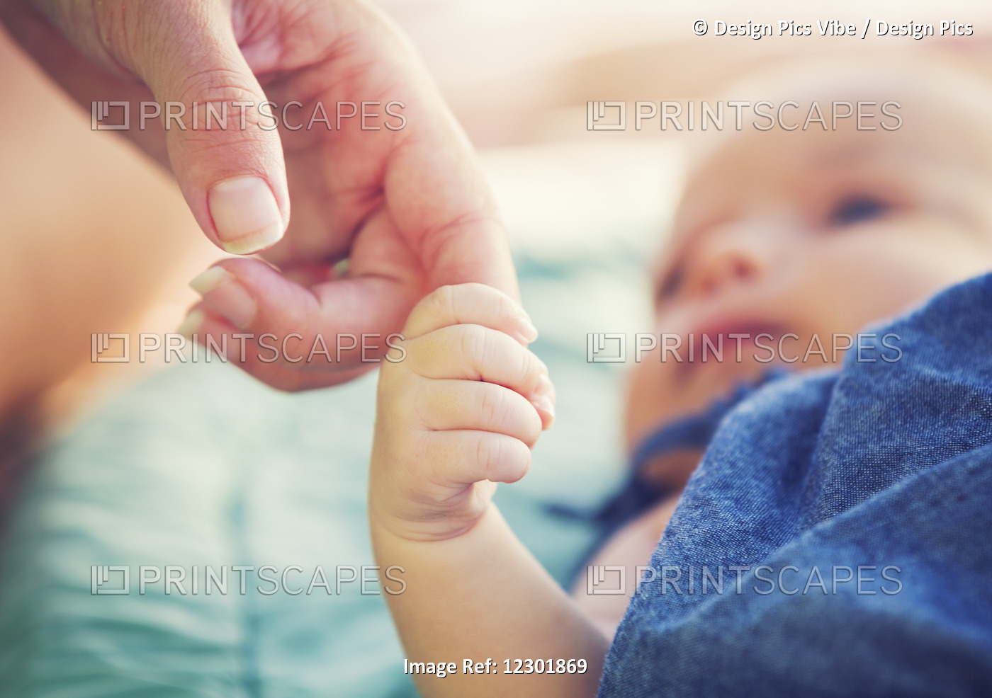 Cute Newborn Baby Holding Mother's Hand