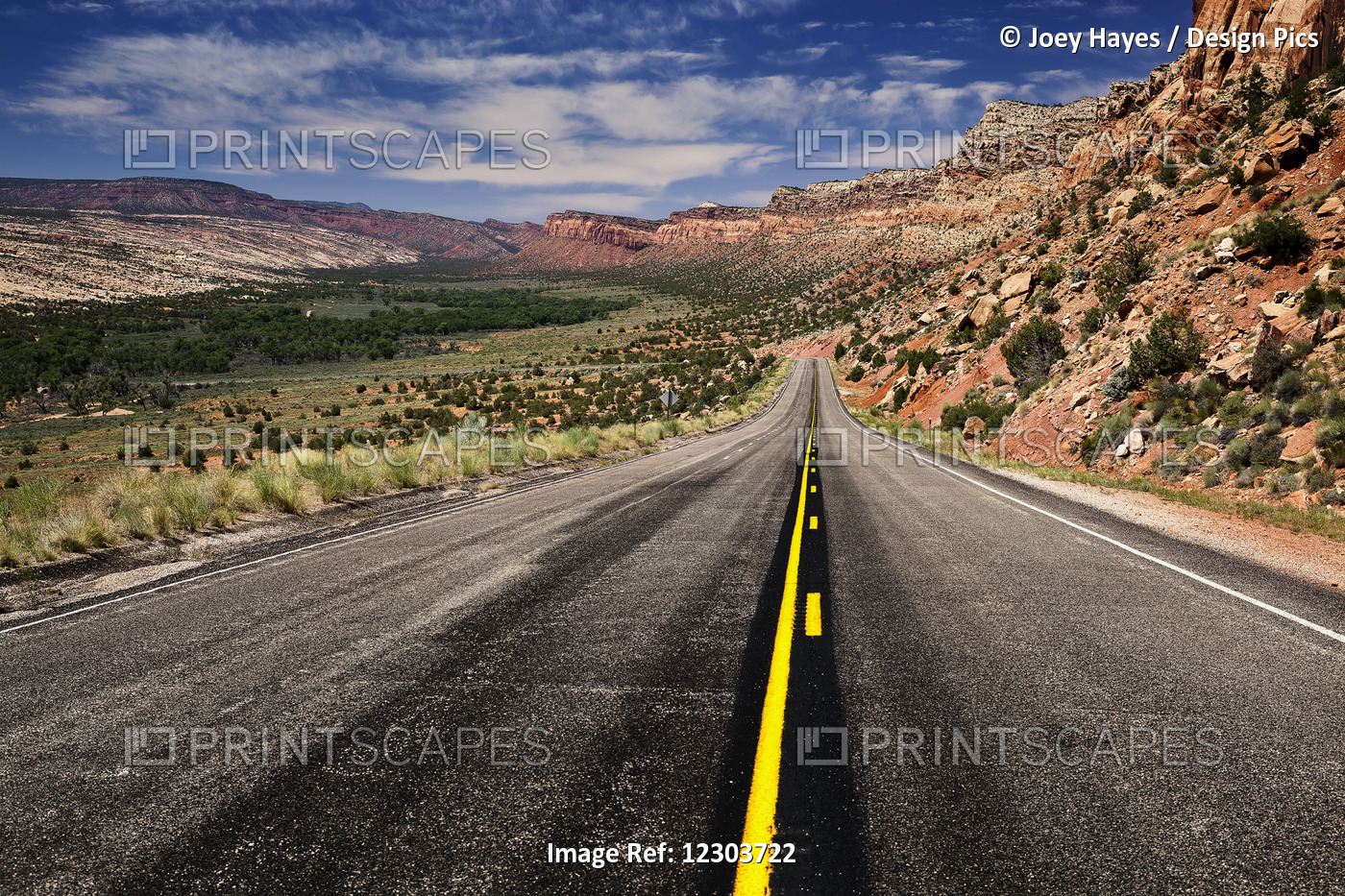 Utah Highway Stretching Into The Distance With Rock Cliffs Wrapping From The ...