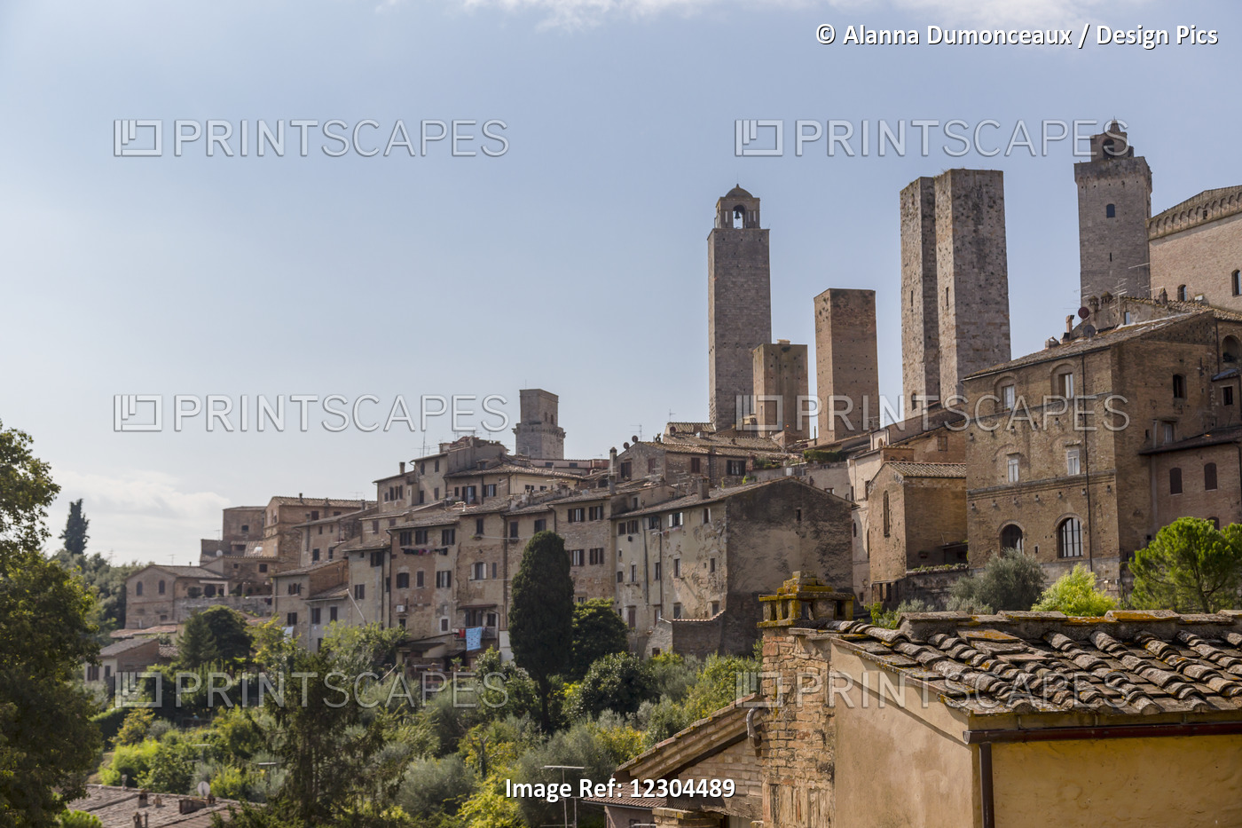 A Rooftop Viewpoint Of The Walled Medieval Village Of San Gimignano In The ...