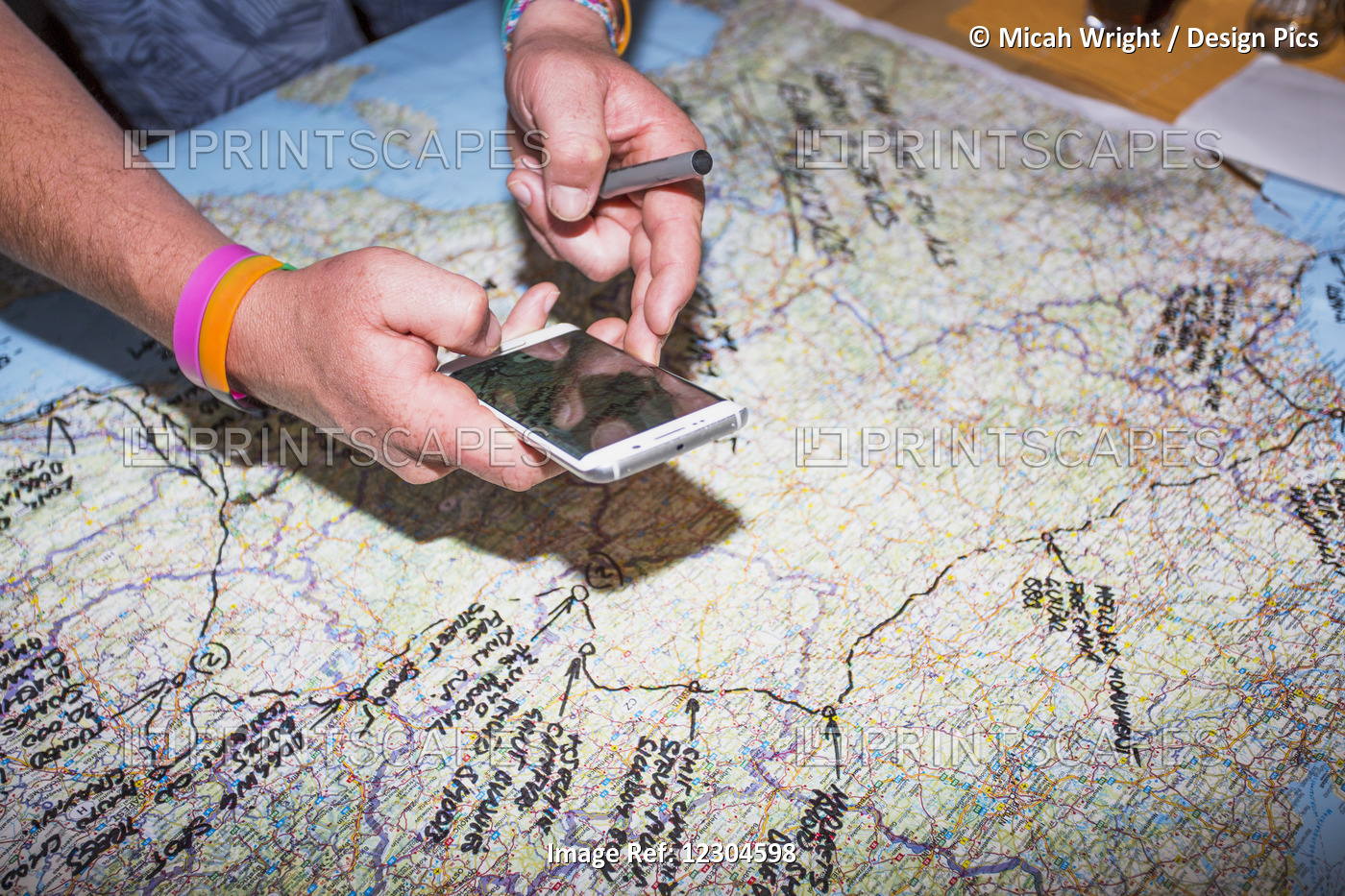 A Man Traces His European Trip On A Map; Bled, Slovenia