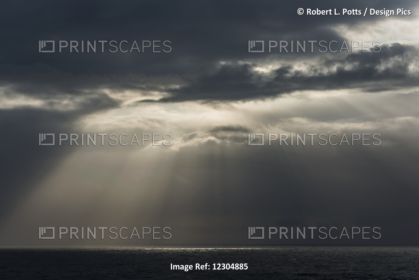 Sunlight Breaks Through The Clouds Over The Ocean On The Oregon Coast; Cannon ...