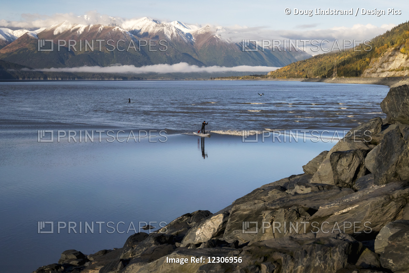 A Paddleboarder Rides A Small Bore Tide In Turnagain Arm While A Drone Follows ...