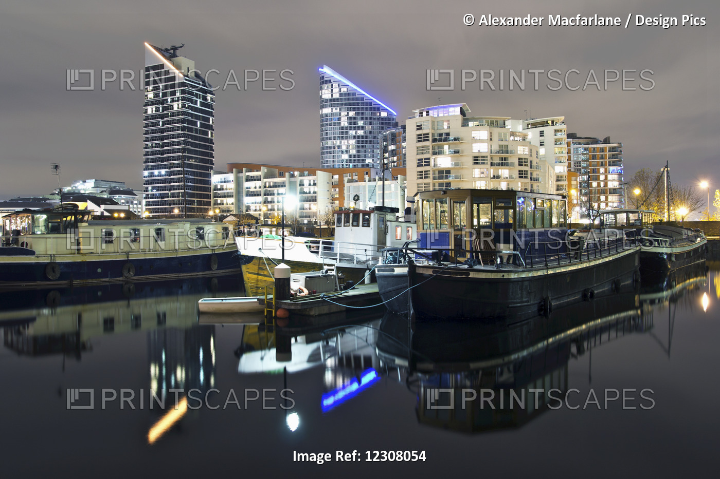 Reflections In Water At Night In Docklands Of London; London, England
