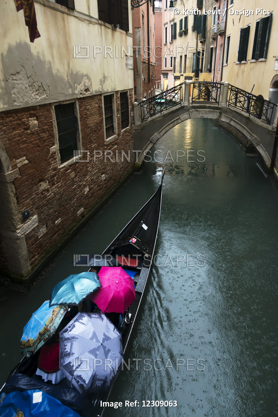 A Gondola Traveling Through A Canal On A Rainy Day With The Passengers Holding ...