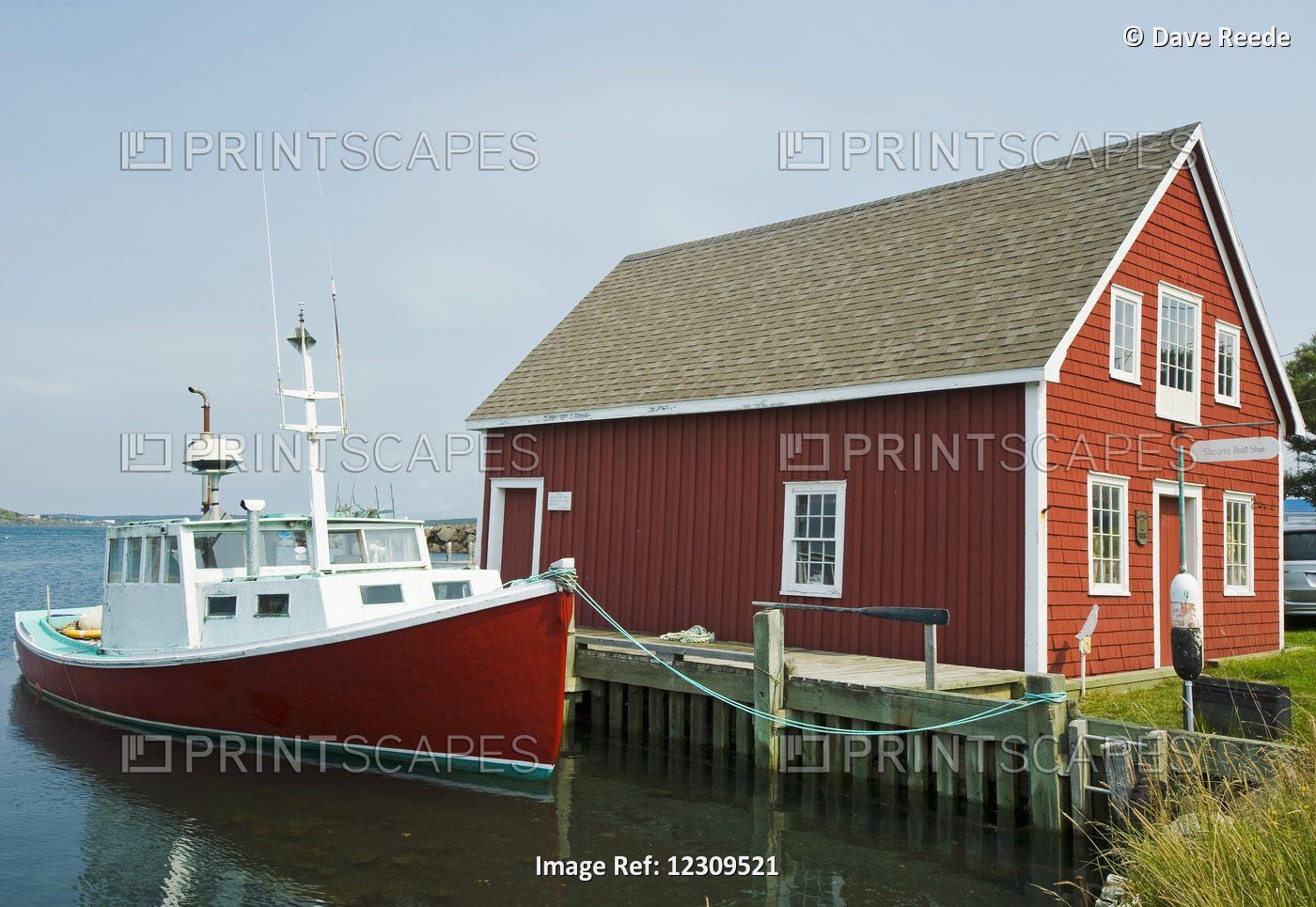 Red Boat At Wharf During High Tide; Brier Island, Nova Scotia, Canada