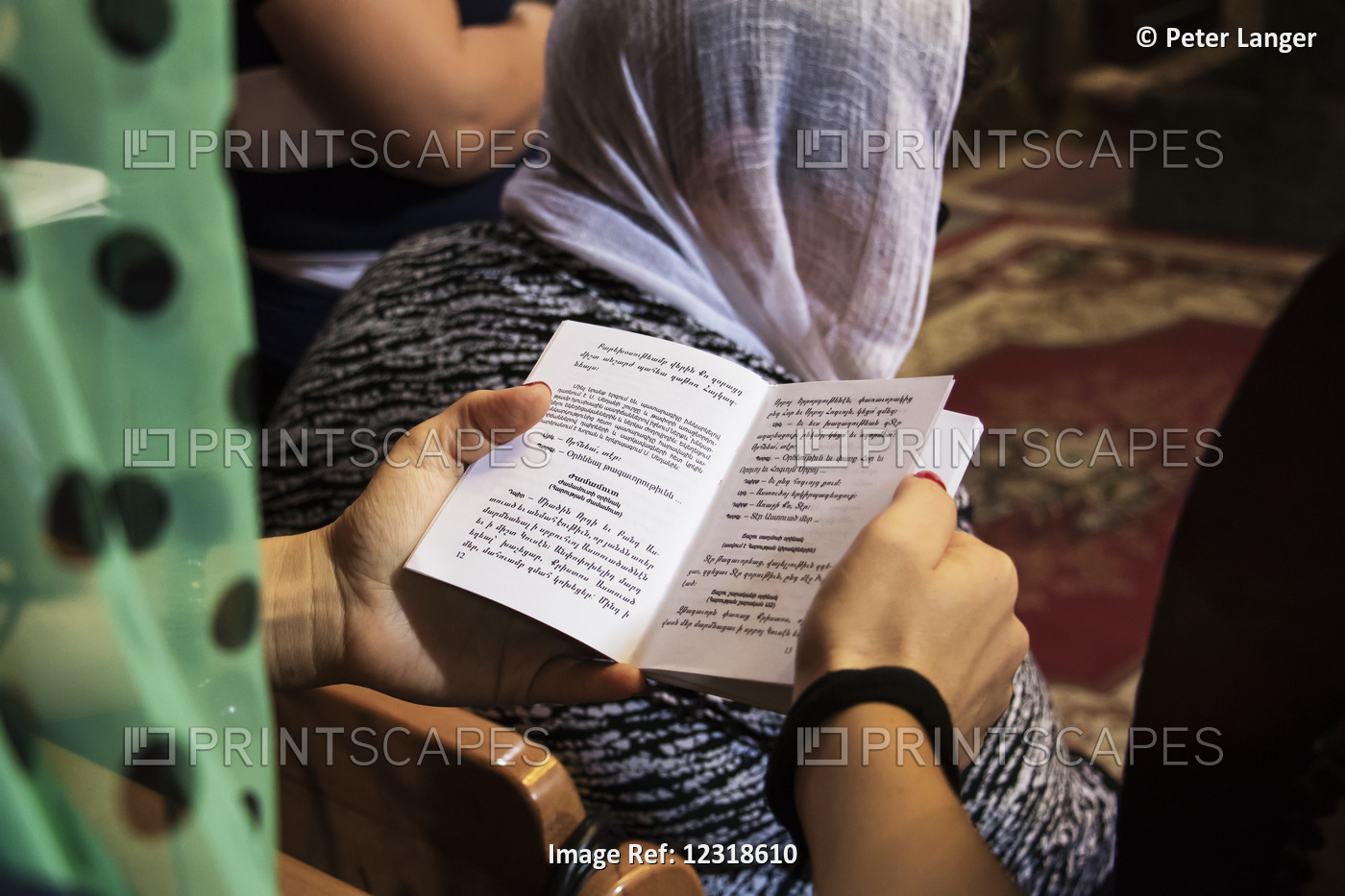Woman Holding A Songbook During The Sunday Divine Liturgy (Mass) In The Church ...