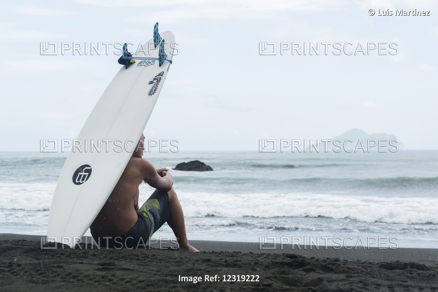 A Surfer Sits On The Shore As He Waits To Get Into The Sea, Waiao Beach, Yilan ...