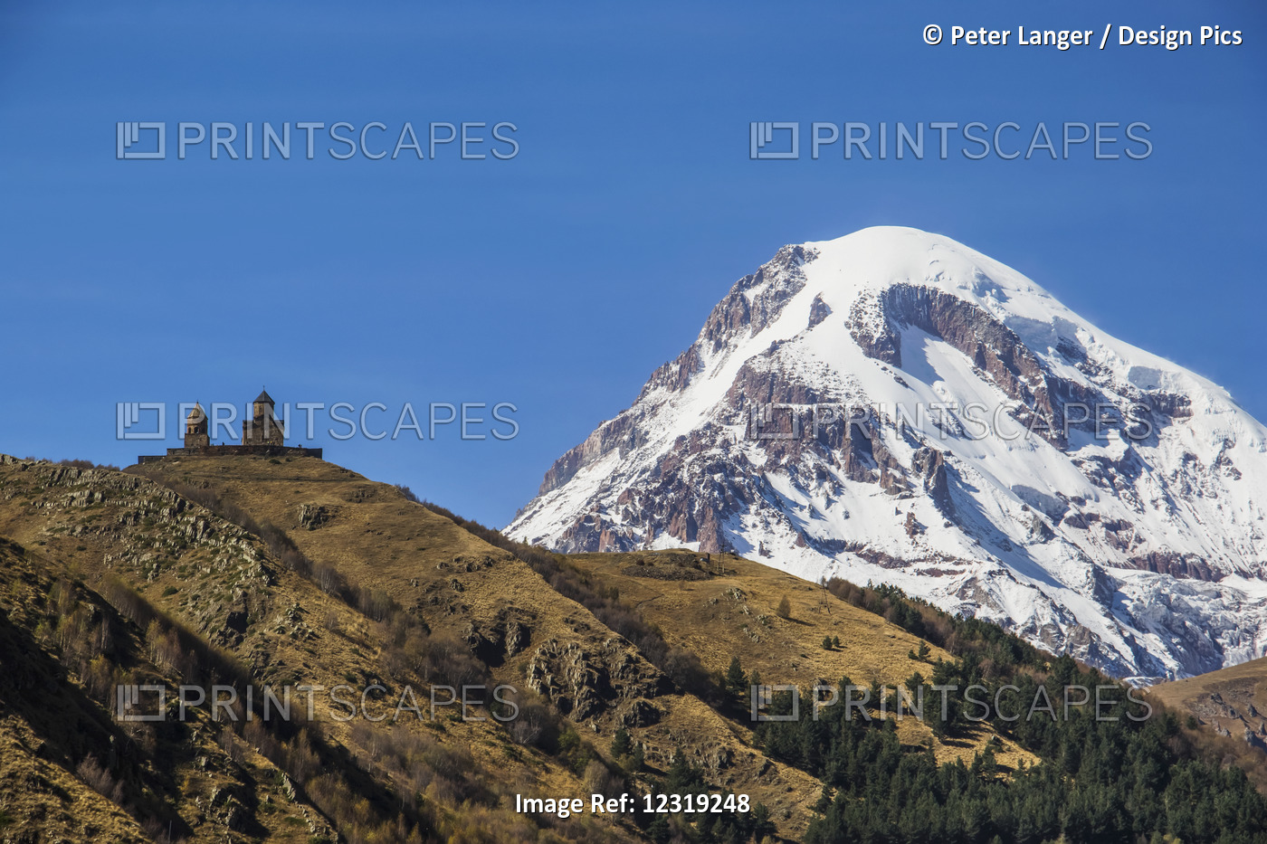 Gergeti Trinity Church With Mount Kazbek In The Background; Kazbegi, ...