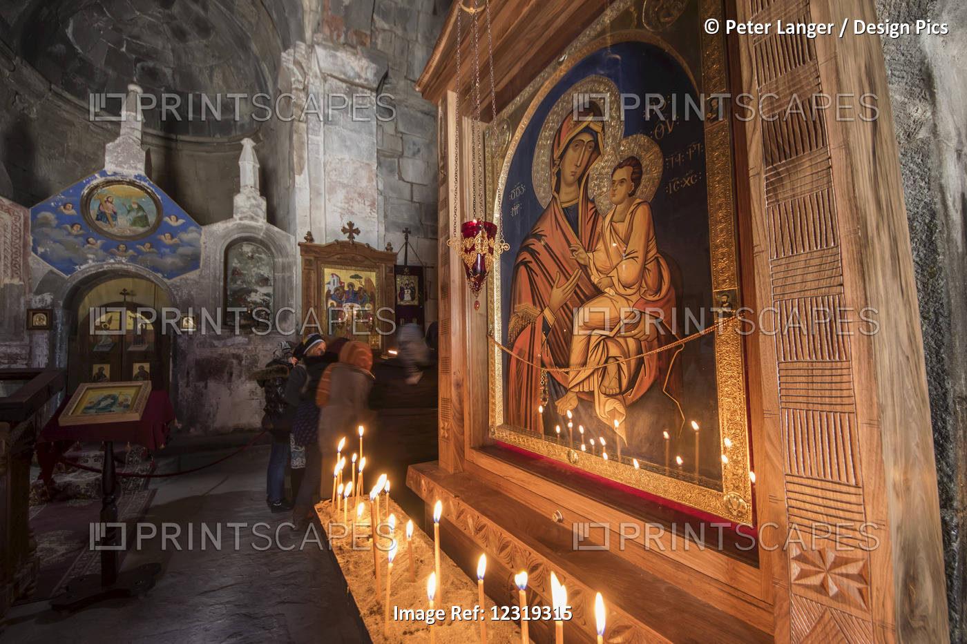 Lit Candles By A Virgin And Child Icon In The Interior Of Gergeti Trinity ...