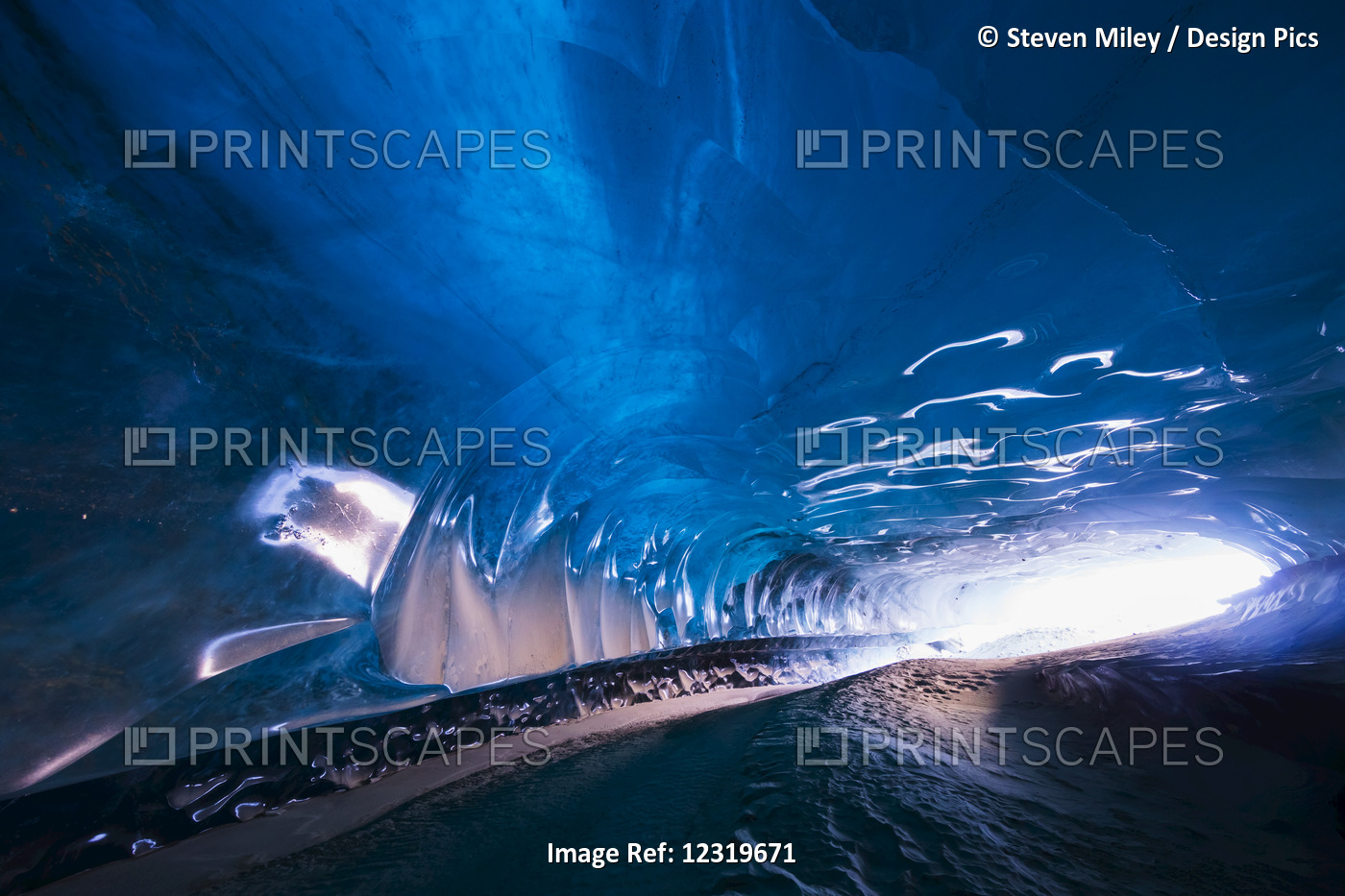 Daylight Shines Into A Tunnel Carved Into The Ice Of Black Rapids Glacier By A ...