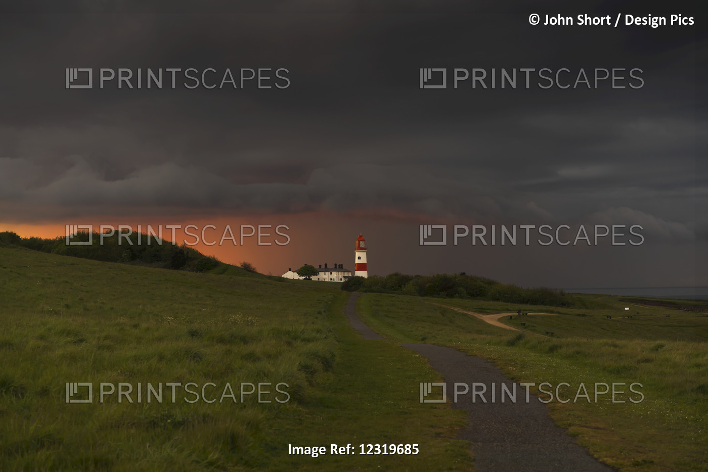 Souter Lighthouse Along The Coast Under Ominous Storm Clouds; South Shields, ...