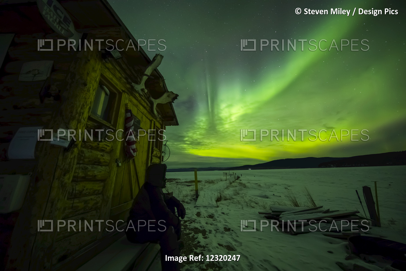 A Man Observes The Aurora From The Steps Of A Hut At Quartz Lake State ...