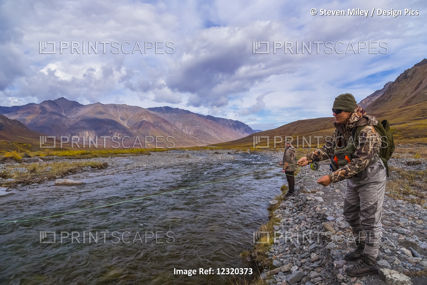 Two Men Fly Fishing For Arctic Grayling On The Atigun River North Of Atigun ...