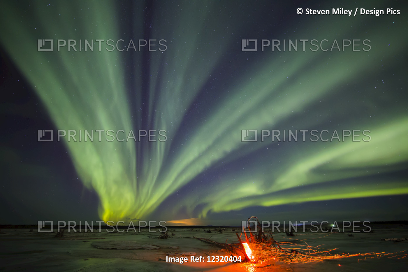 Northern Lights Over Delta River And A Campfire Near Delta Junction, Interior ...