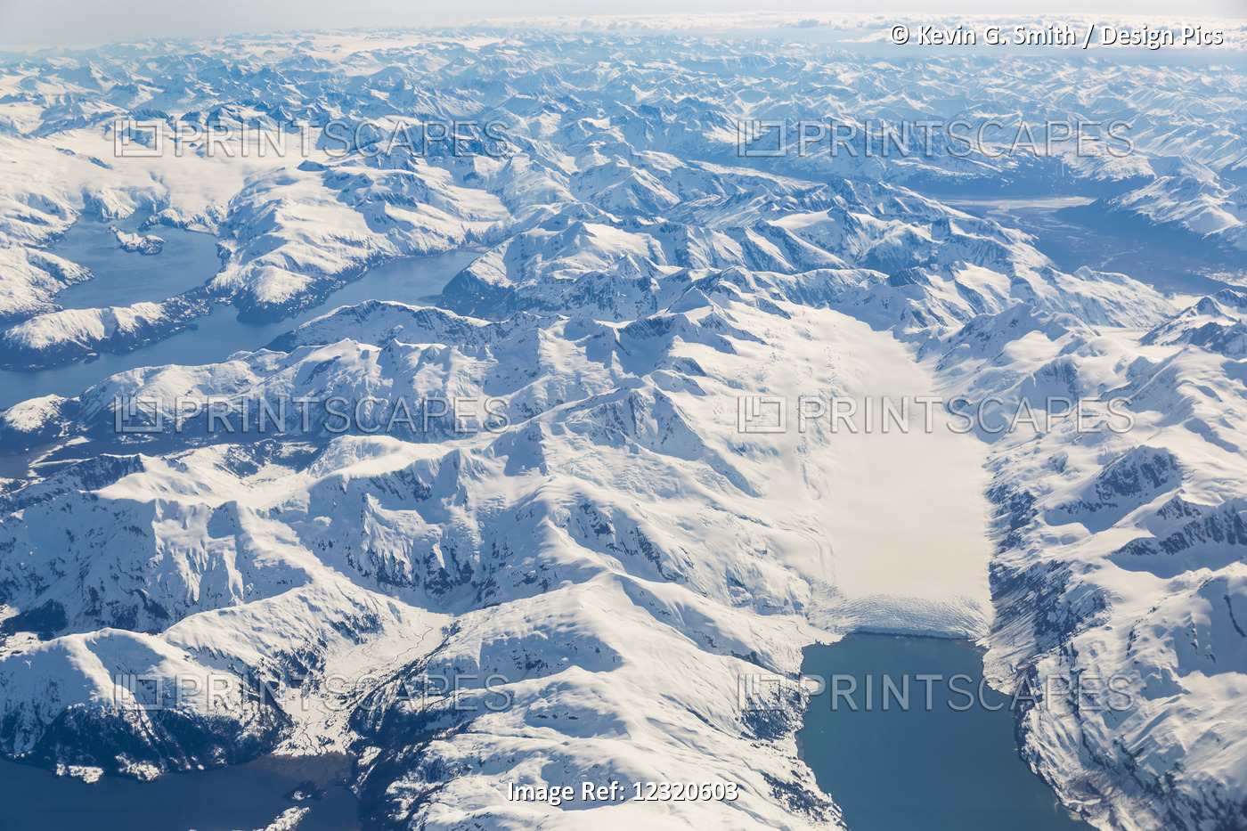 Aerial View Of Snow Covered Mountains In Prince William Sound With A Tidewater ...