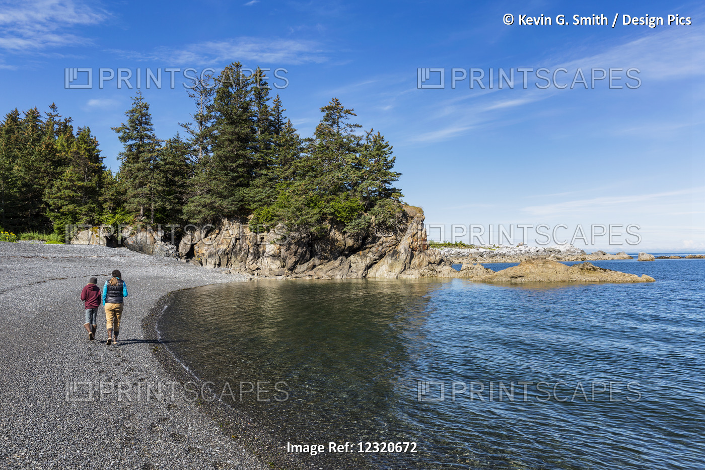Mother And Daughter Walking On The Beach Near Seldovia, Southcentral Alaska, USA