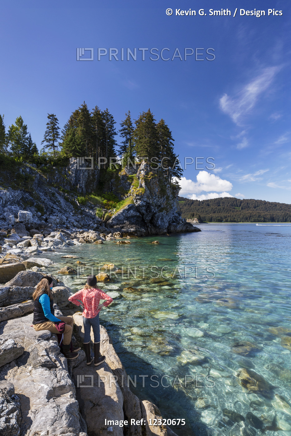 Mother And Daughter Along The Rocky Shoreline Near Seldovia, Southcentral ...