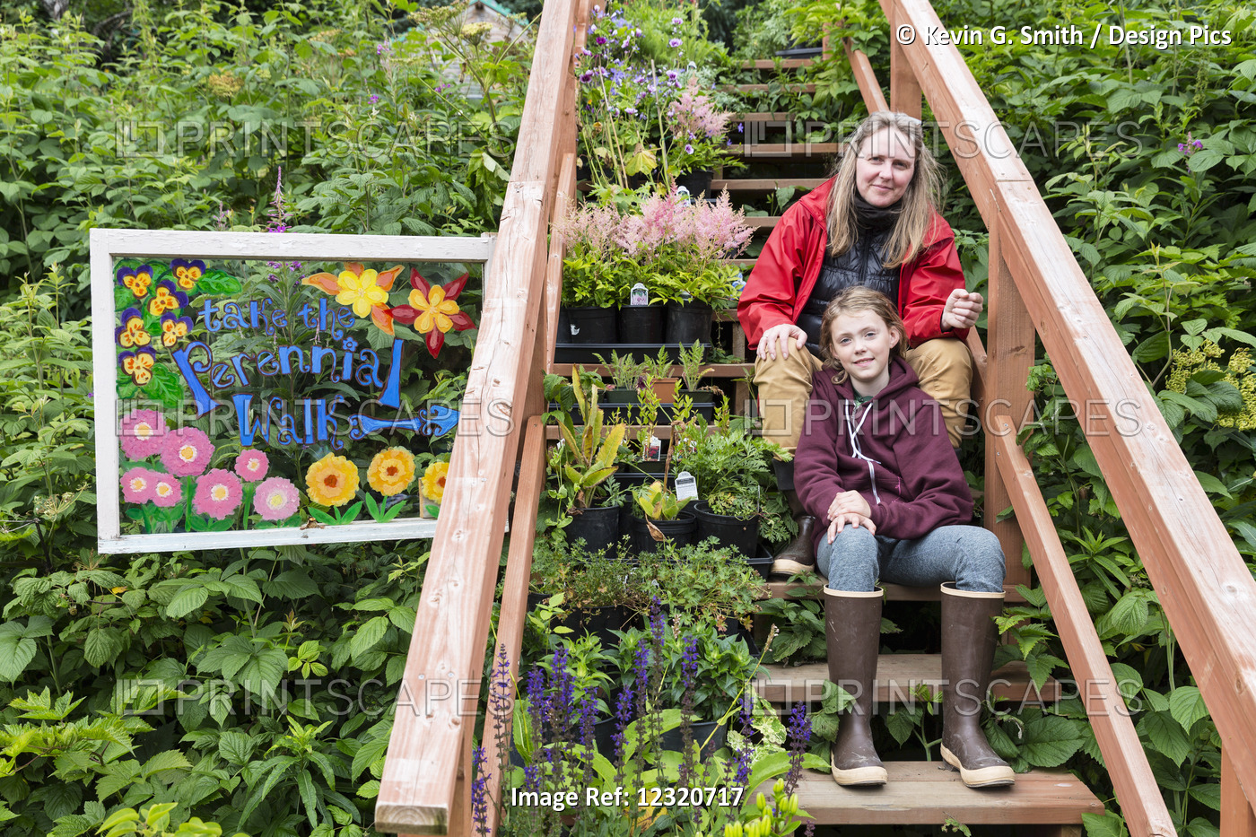 Mother And Daughter Sit On Steps Among A Lush Garden, Seldovia, Southcentral ...