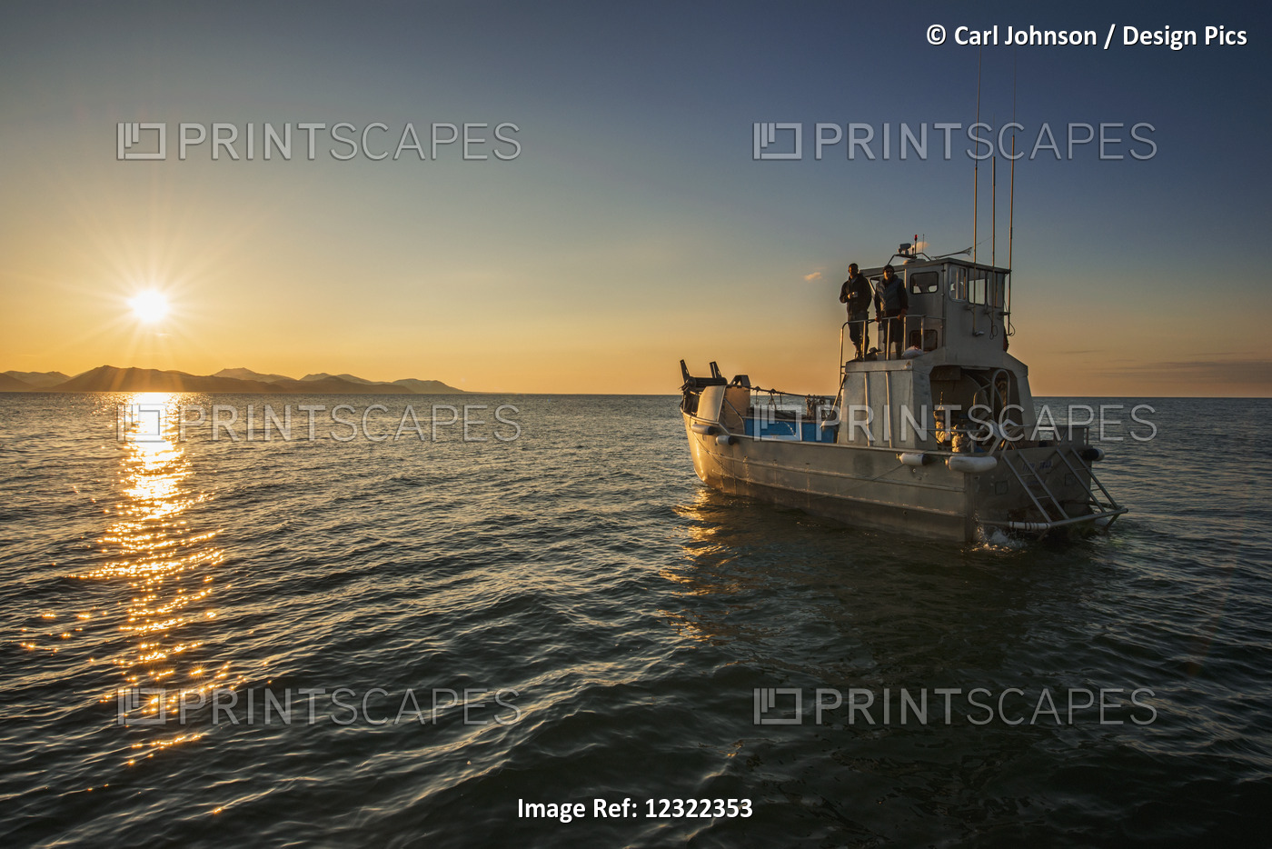 The Sun Rises In The Bristol Bay Region As A Commercial Fishing Boat Floats In ...