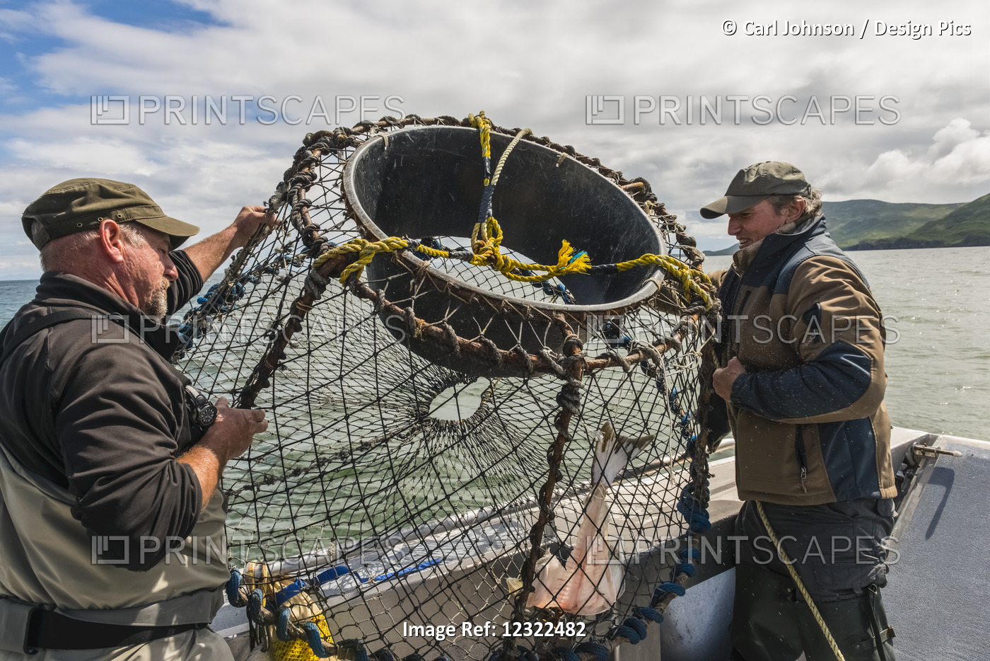 Two Men Prepare To Drop A Crab Pot Baited With Halibut In The Cook Inlet Near ...