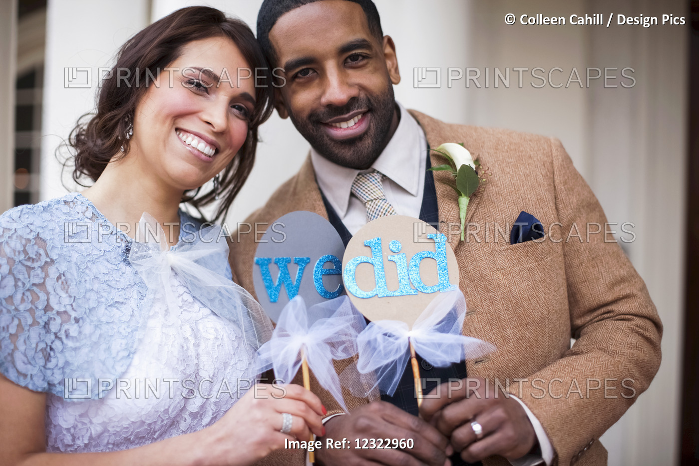 A Bride And Groom Pose With Signs Symbolizing Their Wedding Vows; Portland, ...