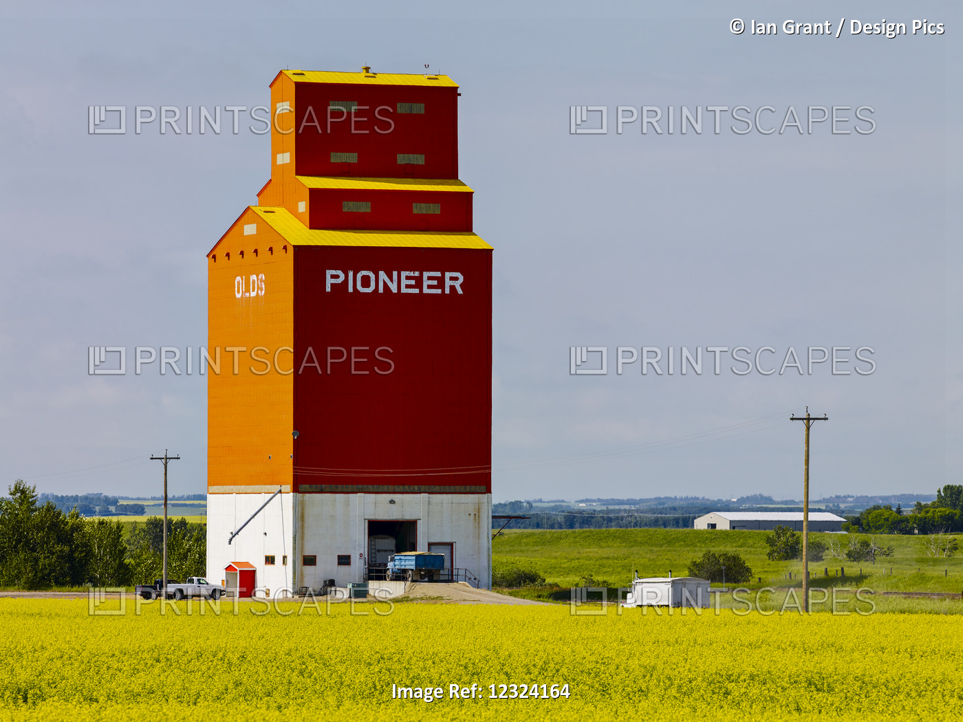A Red Grain Elevator On The Prairies; Olds, Alberta, Canada