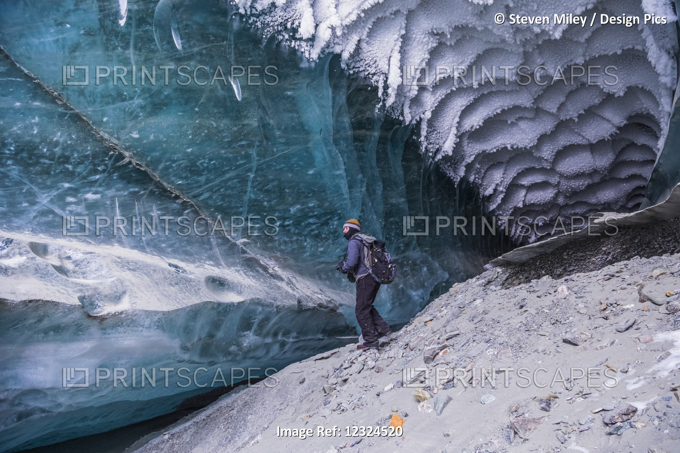 A Man Explores A Tunnel Beneath The Ice Of Canwell Glacier In The Alaska Range ...