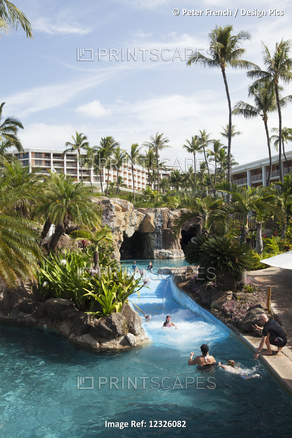 Pool With A River And Swimmers At The Grand Wailea; Wailea, Maui, Hawaii, ...