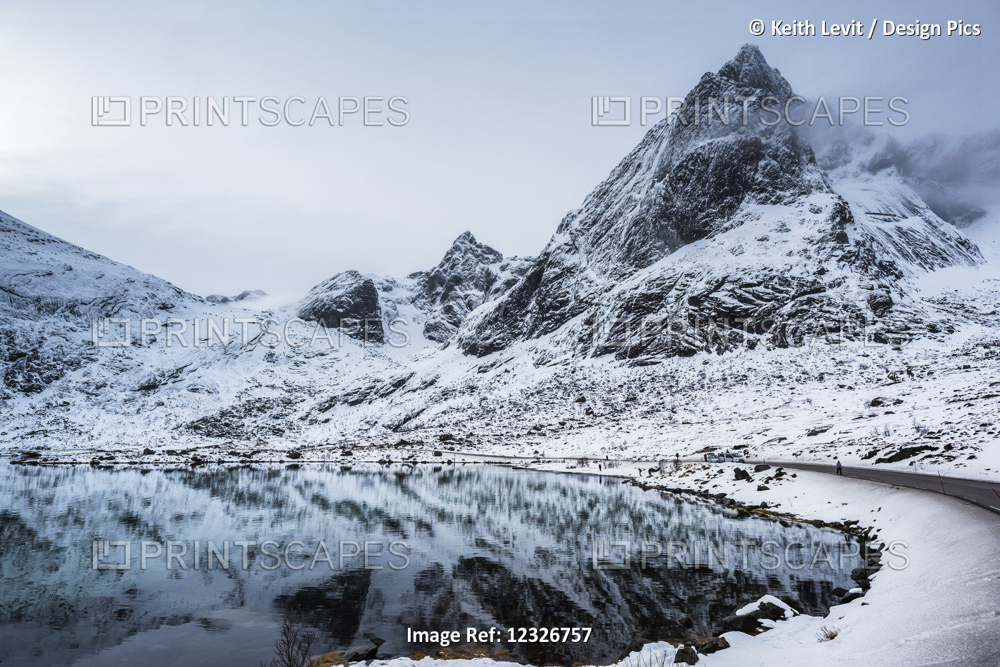 Snowy Landscape Of Rugged Mountains Reflected In Tranquil Water; Lofoten ...
